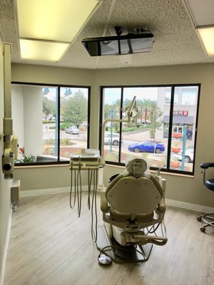 View of Treatment Rooms with city views and overhead TV.