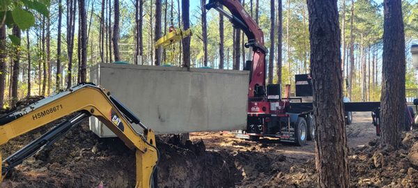 Christian Brothers septic solutions setting our new septic tank.