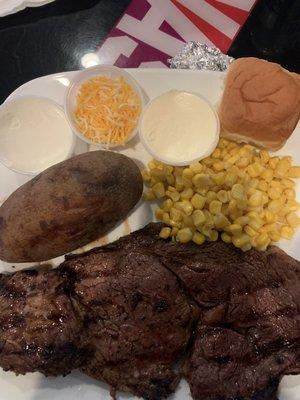 Ribeye steak with baked potato and corn. Highly recommend.