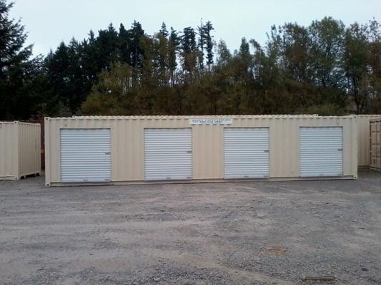 A USED 40' FT CONTAINER WITH FOUR 6' FT WIDE ROLL UP DOORS IS $6,387.00 PLUS TAX AND DELIVERY.