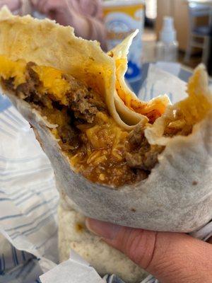 Ground beef combination burrito xtra beef,cheese,red sauce.