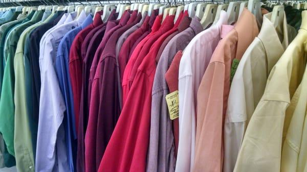 Shirts are organized by color and size for easy shopping