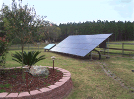 4.8 KW grid-connected solar system mounted on a ground rack.