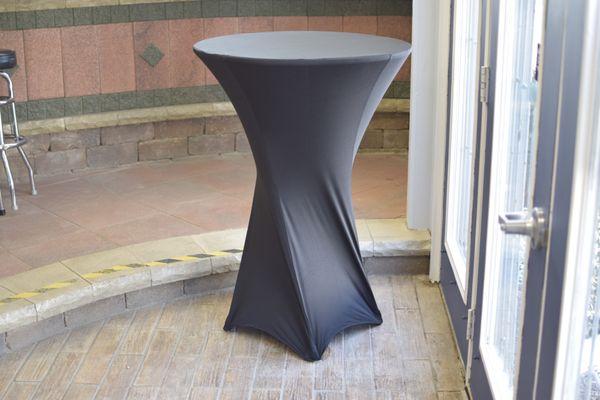 Cocktail table with spandex cover.