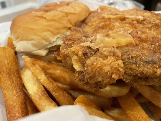 Huge, well seasoned pork chop sandwich