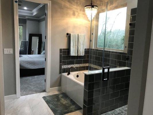 New construction master bath. We used glass tile laid in brick pattern.