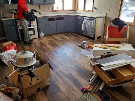 Installed wood floor and marble countertop