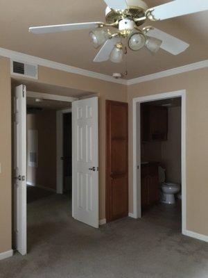 Master bedroom with French doors and master bathroom next to it