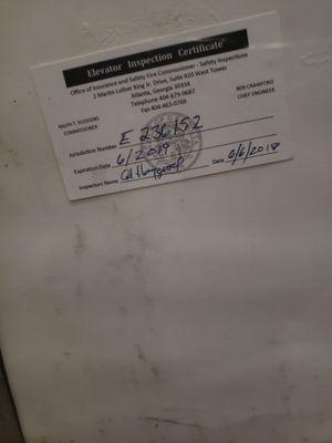 This is a picture of the current elevator inspection certificate that is PAST DUE. These elevators constantly break down.