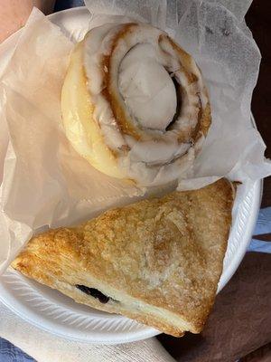 Cinnamon roll and blueberry turnover