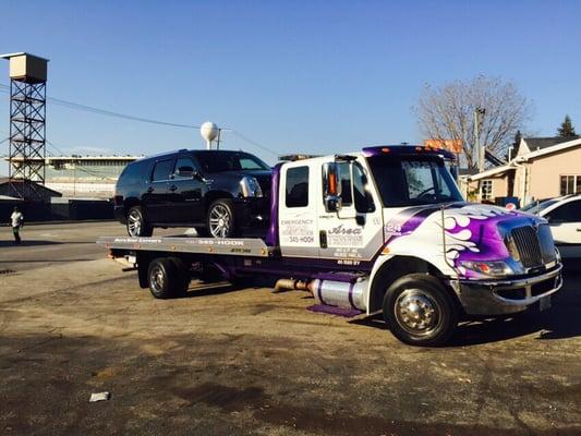 One of our many flatbed tow trucks.