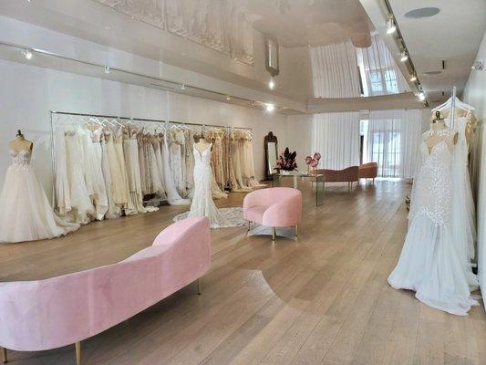 Interior of the LBR Bridal salon, showcasing some of our beautiful gowns and a relaxing sitting area.