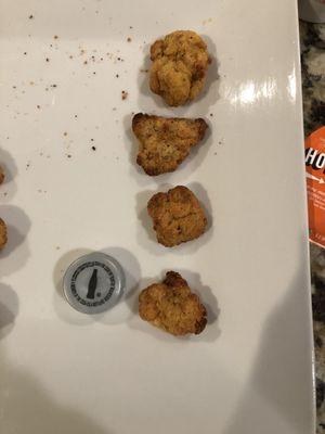 "Chicken"...breading, no meat and smaller than a bottle cap.