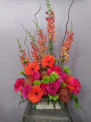 Bold colors with roses, Gerbera daisy, Protea and snapdragons