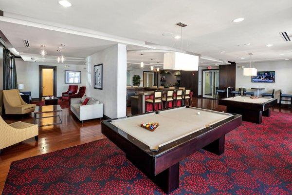 Club Room with fireplace, pool table, TV's, media lounge, bar, seating areas