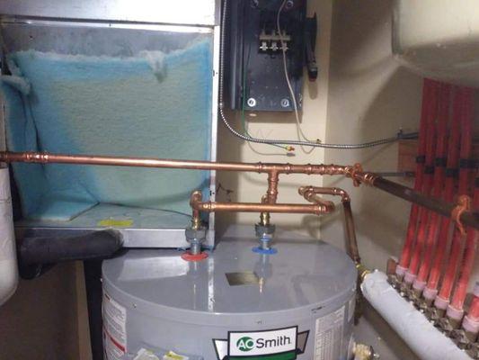 Piping in a hot water heater