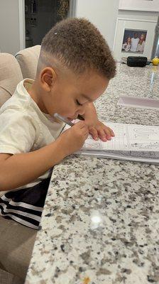 He loves his homework!