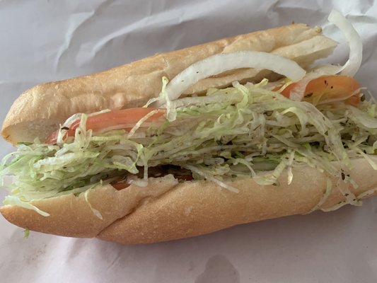 Half consumed cheese hoagie. Perfectly and freshly prepared.