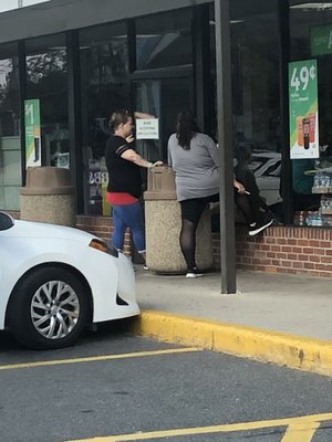 Rude woman in black and red who works there