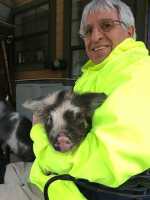 David is holding Miss Petunia, our baby KuneKune piggie, the smallest breed of pigs--ever so sweet!