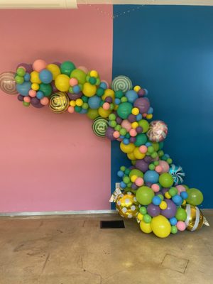 Our Balloon Garland Vibes can be dressed up to fit any theme! Our Charlie and the Chocolate Factory themed baby shower garland