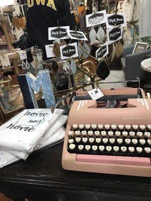 A PINK typewriter and earrings