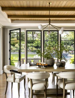 Breakfast room featuring white oak floor and ceiling accents.