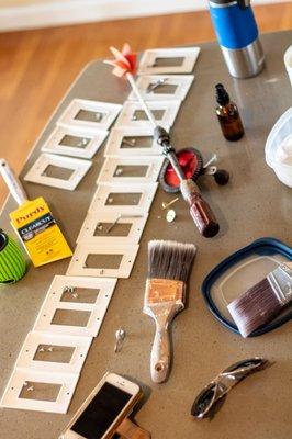 Gotta keep it organized. Well actually my photographer haphazardly placed my shtuff on the table. It WAS organized - the switch plates.