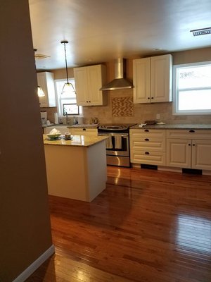 Kitchen, Cabinets, Granite, Tile, Hardwood Flooring, Kickspace Heater, island, Recessed Lighting, Pendant Lights, Range, Stainless Vent