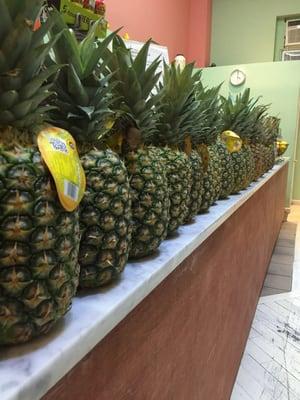 Pineapples along the counter