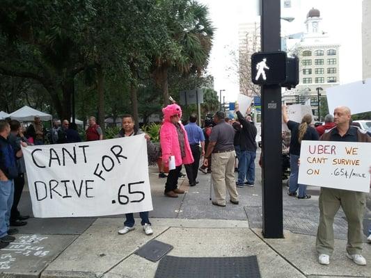 Uber drivers protesting against reduced seasonal rates in downtown Tampa at Lykes Gaslight Park.