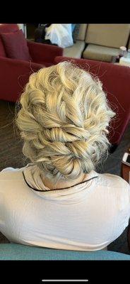 Polished natural curl updo