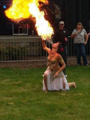 Really awesome belly dancer breathing fire.