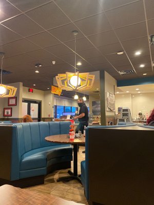 Denny's restaurant with a employee in the photo.