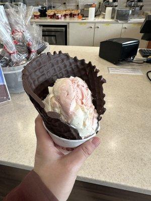 Dipped chocolate cone with "small size" strawberry and cheesecake flavors mixed together