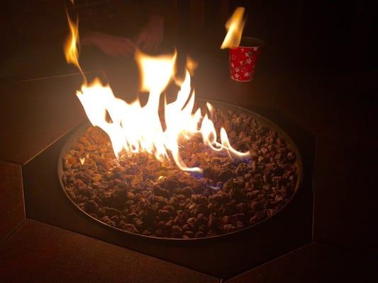 A couple little LP fire pits in their backyard