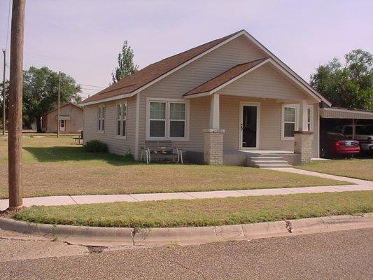 AFTER  New vinyl over old stucco. Hard to tell it's the same house