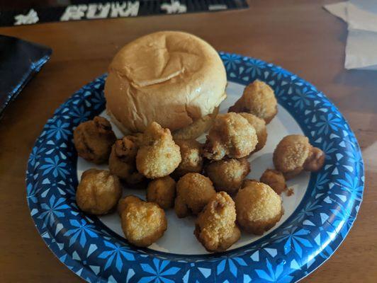 Fish sandwich with fried mushrooms