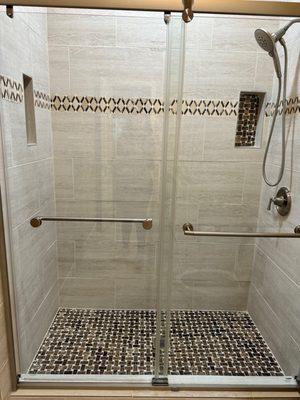 $9,999.00 Shower upgrade. Includes tile walls, new fixtures, glass shower door, and toilet.