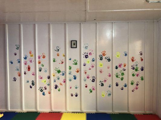 Playroom covered with local kids handprints