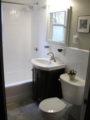 My new bathroom. Tiles used to be pink and black! Sure, retro is cool, but neutral sells. Plus, look how clean. Loved it. SOLD!