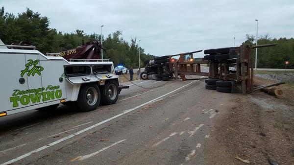 Log truck overturned