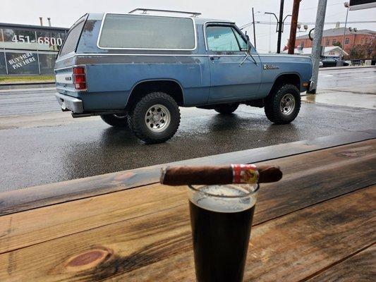 Drinking the Macho Man Stout , out in the front patio. Picture of my beast in the background.