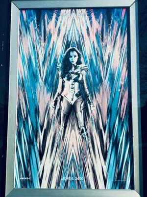 Wonder Woman 1984 movie poster. It's been delayed so long the poster has been bleached by the sun