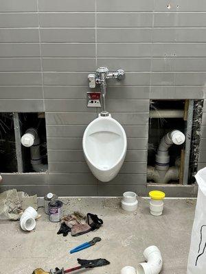 Commercial Plumbing Contractor - urinal installation - plumber