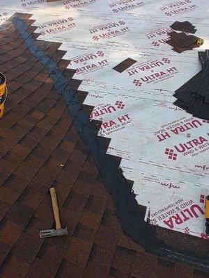 30 year shingle roof system being installed