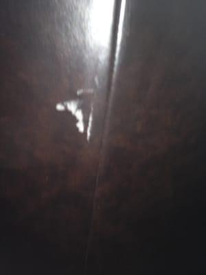 Tear in leather in one of my couches. Looks small in the picture but it's not.