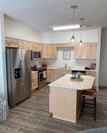 Beautiful maple cabinets, kitchen island, new appliances and so much more...