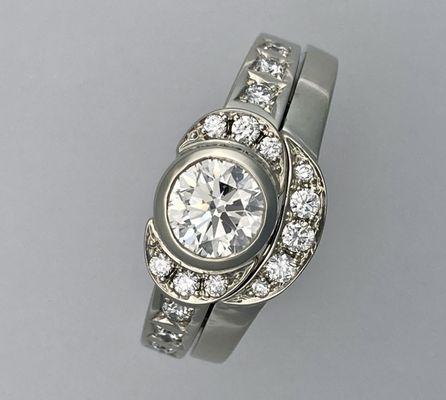 Wedding set with pavé-set melee diamonds and bezel-set center diamond in 14k white gold. An Apricot original.