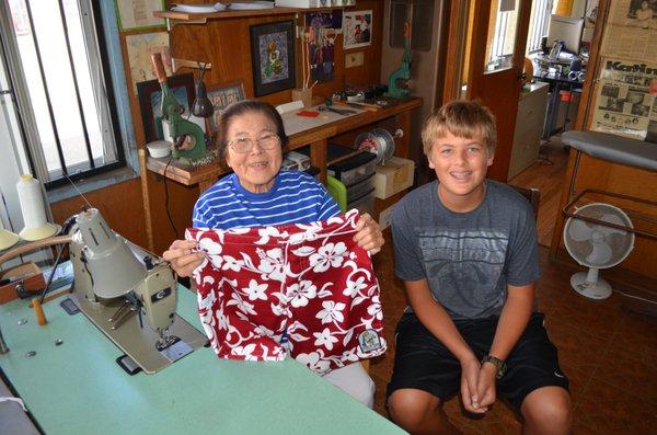 Sato sewing Daniel's first pair of Katin trunks!